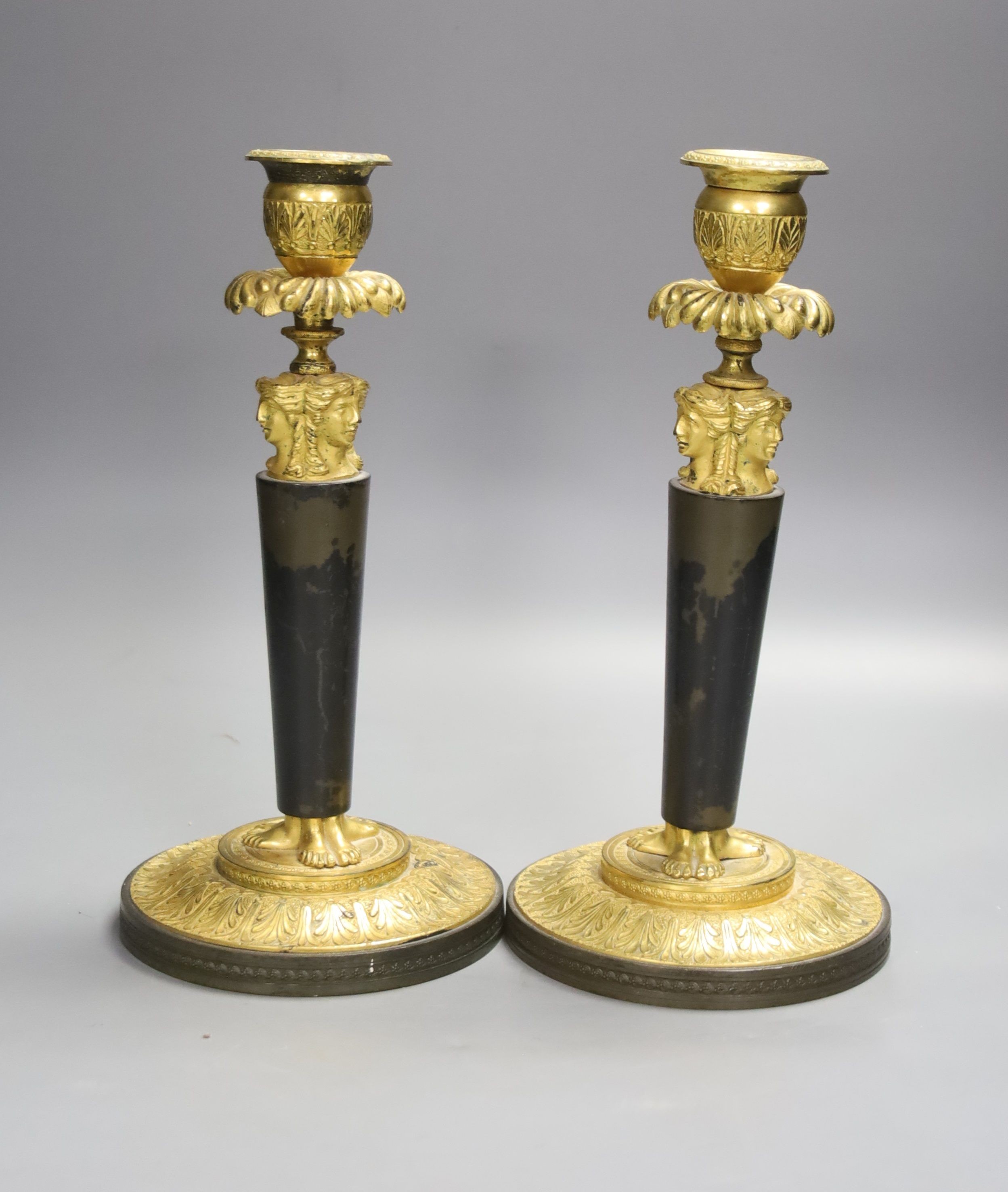 A pair of 19th century bronze and ormolu figural candlesticks, height 25cm